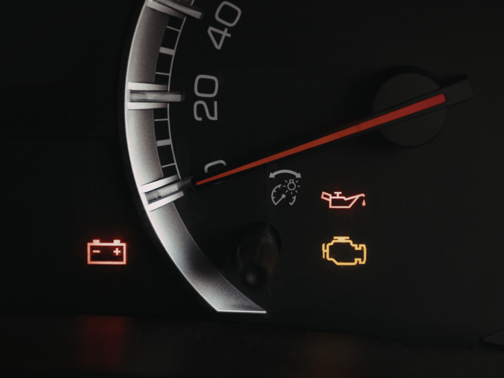 Common dashboard warning lights displayed in a car
