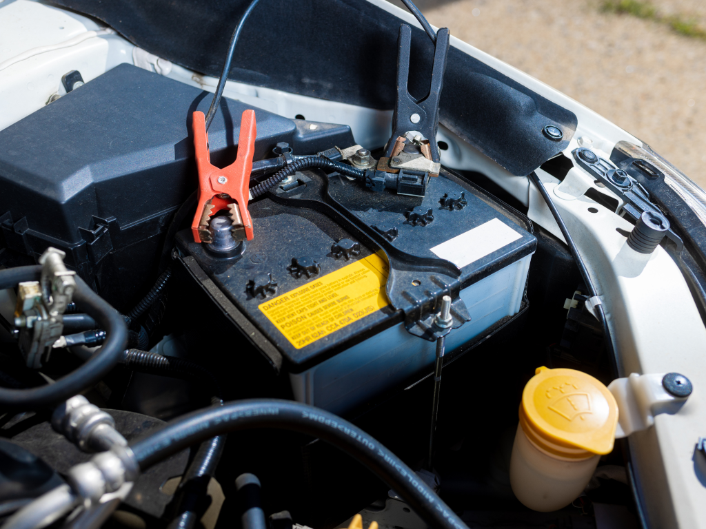 Mechanic checking a car battery to diagnose starting problems